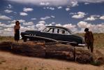 1952 Buick Super 88, Petrified Tree, Cumulus Clouds, Woman, Man, 1950s