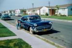 Boy, Girl, 1956 Buick, Homes, houses, street, Sidewalk, 1950s