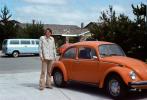Man Stands by his Volkswagen Bug, 1970s