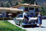 1957 Ford Fairlane 500, 4-door, Sitting Boy, Woman