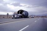 Oversize load, Flatbed Trailer Truck, wide, desert, north of Bishop, US Highway 395, pipe, tube