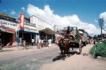 Oxen, Cart, Desert, Bata, road, highway, stores, shops, buildings, clouds
