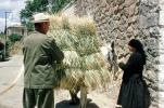Hay, woman, man, Delphi, Greece