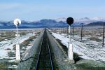 Signal Light, Railroad Tracks in the Snow, Brush, Shrub, Ice, Cold, Cool, Frozen, Icy, Winter, hills, mountains, VRFV03P03_17
