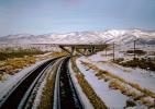 Interstate Highway I-80 Overpass, Railroad Tracks in the Snow, Brush, Shrub, Ice, Cold, Cool, Frozen, Icy, Winter, hills, mountains, VRFV03P04_09.0586