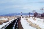 Signal Light, Railroad Tracks in the Snow, Brush, Shrub, Ice, Cold, Cool, Frozen, Icy, Winter, hills, mountains, VRFV03P05_02