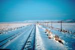 Railroad Tracks in the Snow, Brush, Shrub, Ice, Cold, Cool, Frozen, Icy, Winter, hills, mountains, VRFV03P07_04.3290