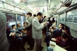Crowded Train, passengers going home, suits, men, women, interior, inside