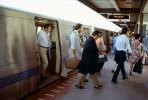 Passengers exiting a BART train, Commuters, Bay Area Rapid Transit, disembarking, people, 1980s