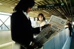 reading a newspaper, Daly City Station, Bay Area Rapid Transit, BART, Oakland Tribune, commuters, 1980s, VRHV02P02_07