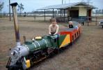 Boy as Train Engineer, girls, brother, sister, Miniature Train, April 1962, 1960s
