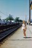 Little Girl waiting for Train, Railroad Station Platform, June 1962, 1960s, VRPV08P14_16