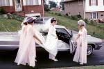 Bride getting inside a car, 1960s, WEDV16P15_10