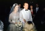 Bride and Groom, heading down the aisle, flower Bouquet, veil, suit, bow, 1950s