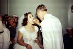 Bride and Groom eating cake, 1950s, WEDV25P14_02